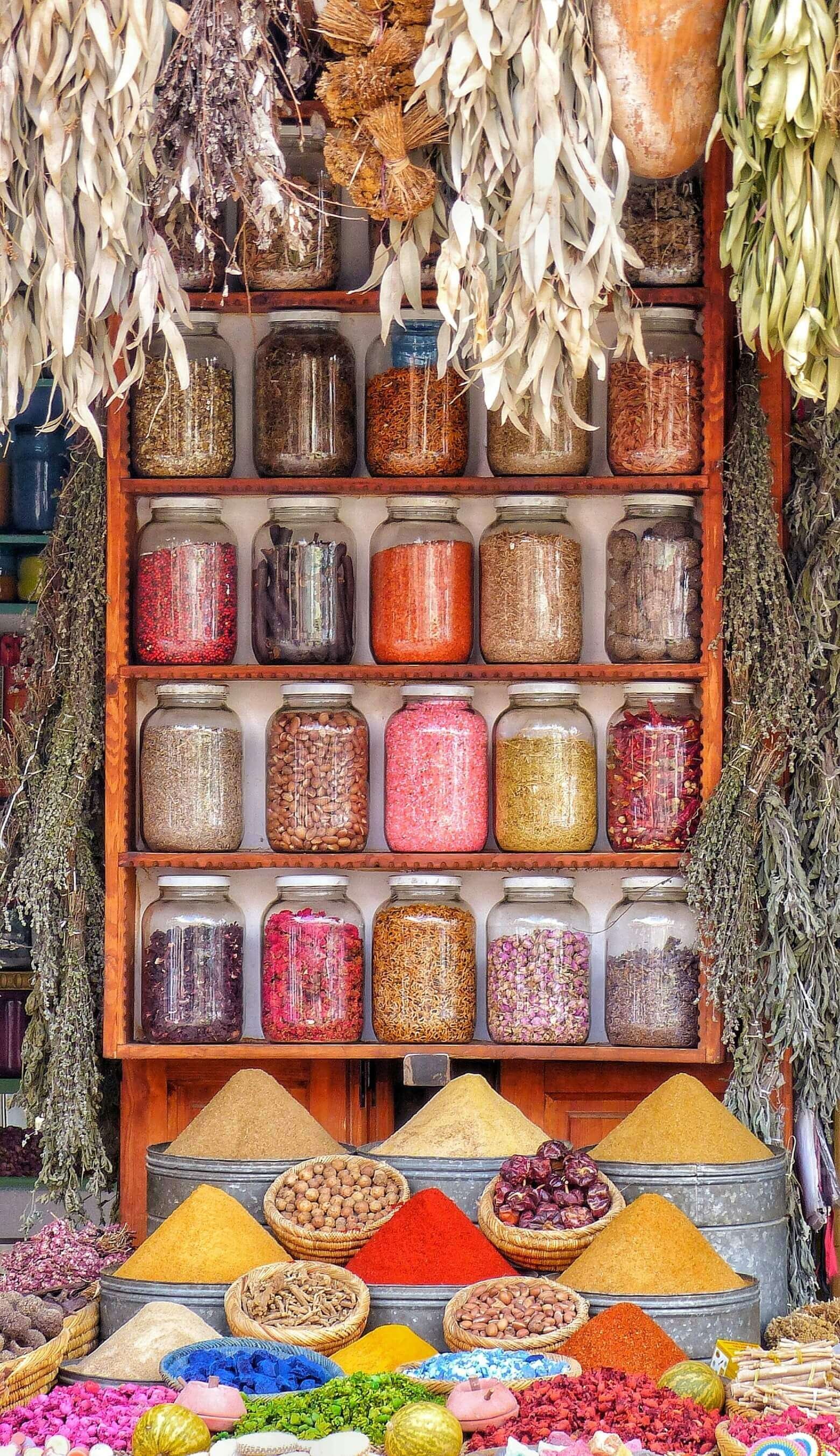 colorful-spices-in-a-traditional-Moroccan-souk,-illuminated-by-warm-lighting-that-enhances-the-gorgeous-architecture-surrounding-the-scene.-This-bustling-market-reflects-the-rich-local--1-.jpg