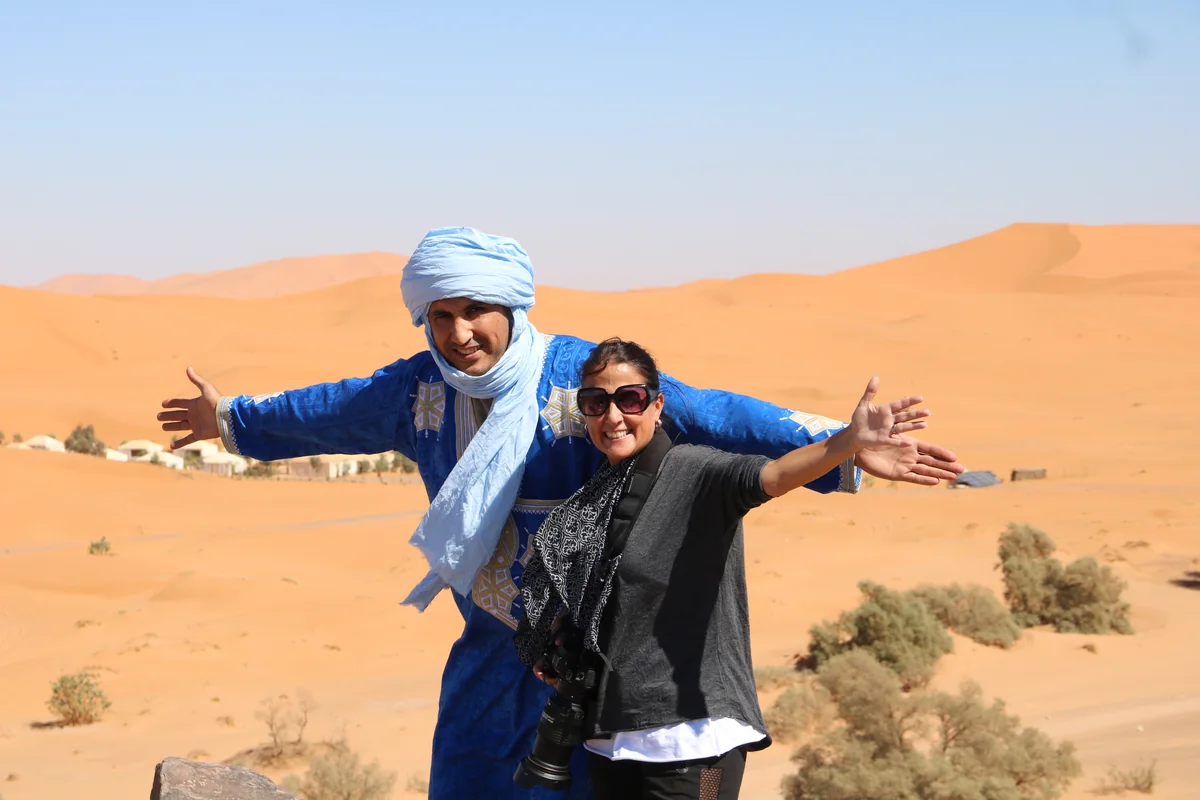 Travelers with their guide in the Erg Chebbi dunes near Merzouga