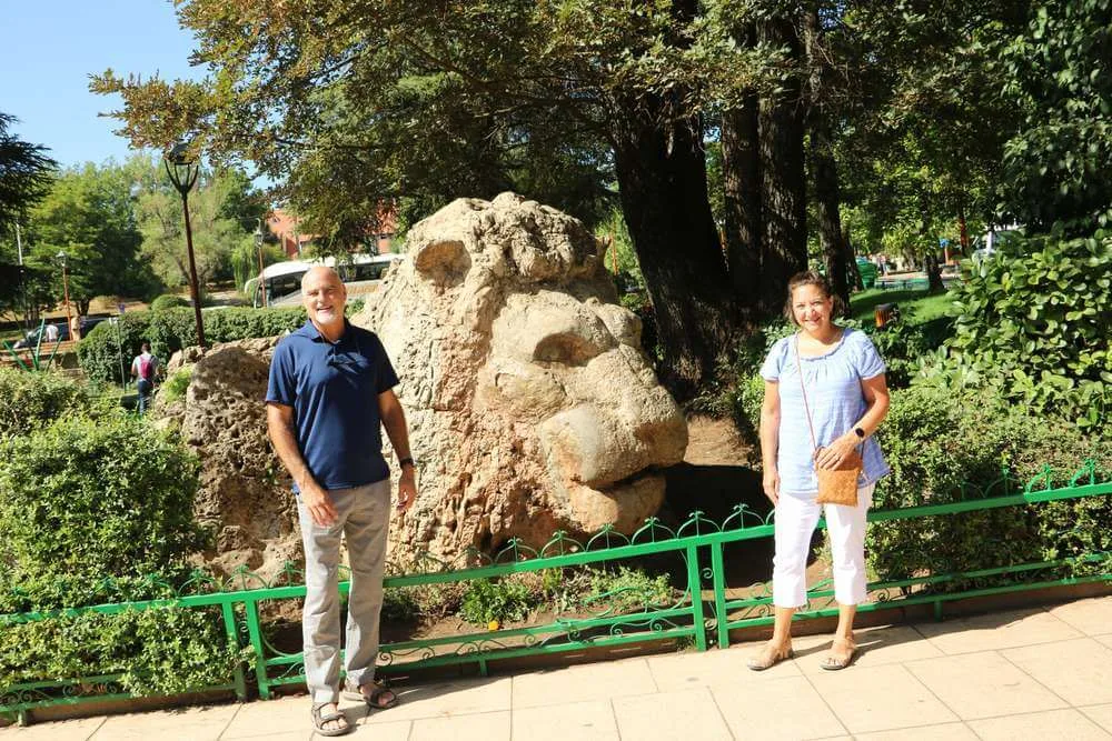Travelers beside the stone lion in the park at Ifrane, the first stop on the drive from Fes