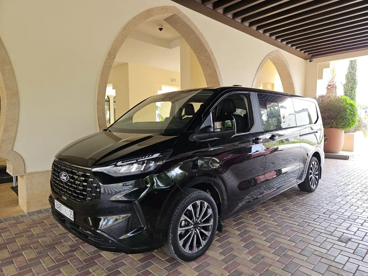 The van used for private Morocco tours, parked outside a riad before departure