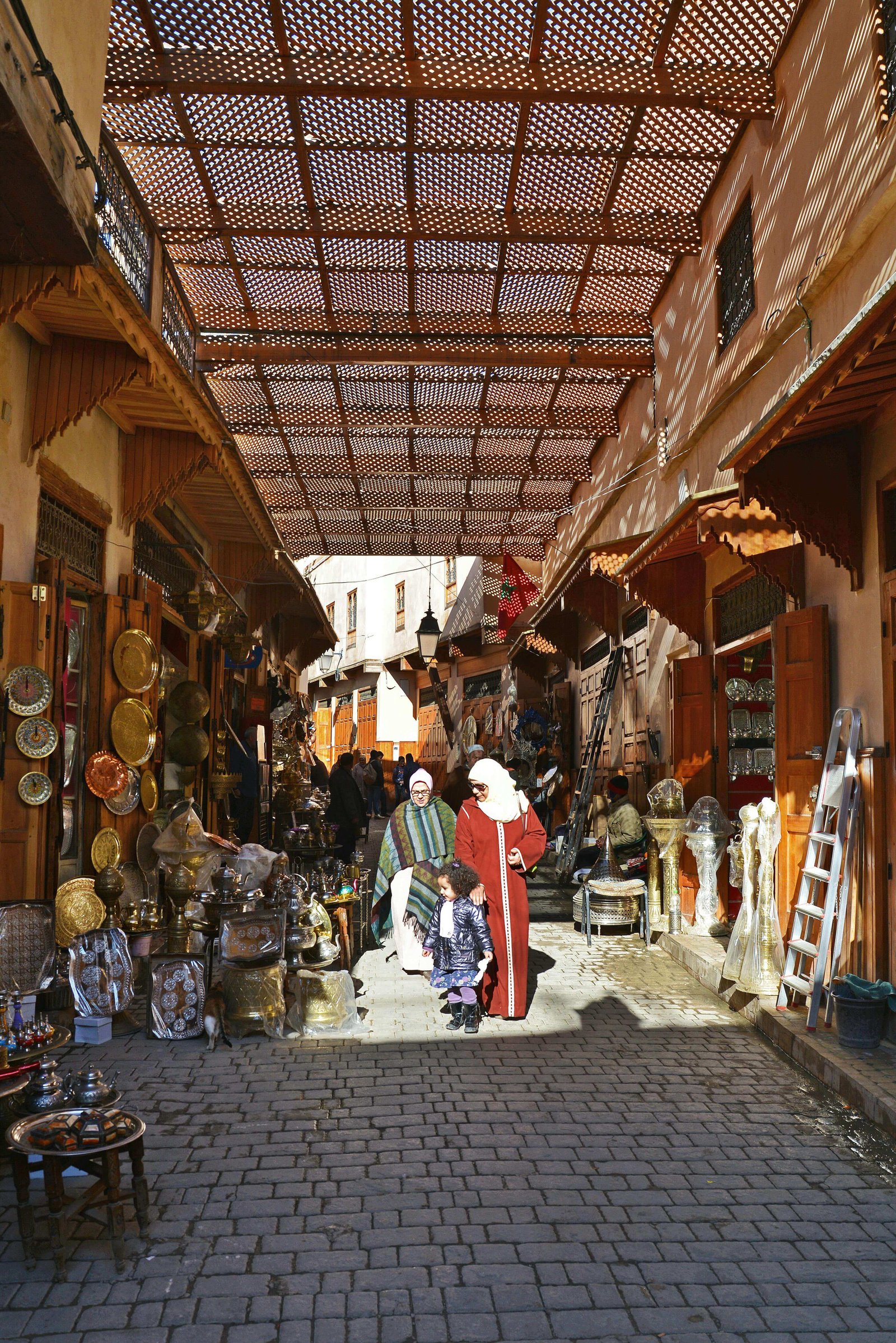 the-vibrant-Marrakech-souk,-filled-with-colorful-textiles-and-traditional-lanterns,-showcasing-the-bustling-market-activity-that-defines-the-city's-rich-culture.-Visitors-can-immerse-themselves-in-this-lively-atmosphere,-a-h.jpg