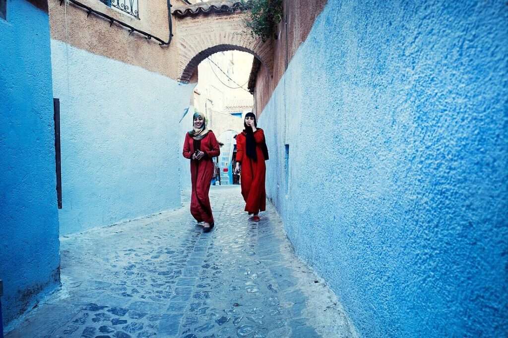 Two smiling Moroccan women walking